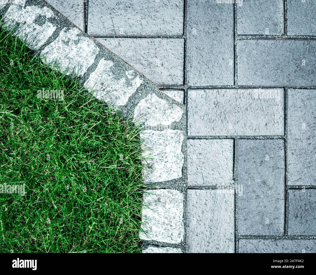 Cobblestone and grass view from above Stock Photo