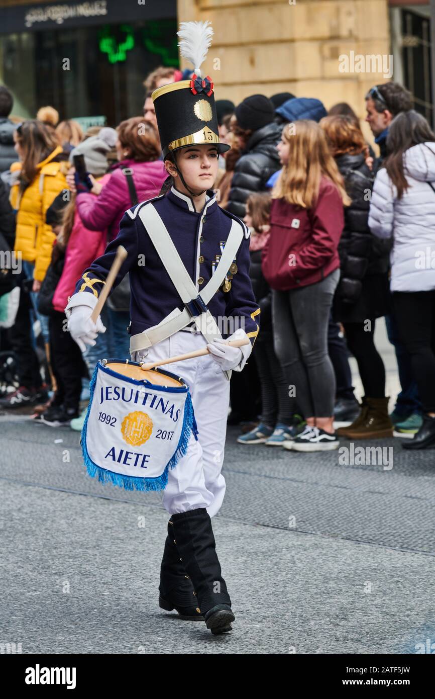 Traditional Tamborrada parade of children dressed up as soldiers and  cooks in Donostia-San Sebastian, Spain Stock Photo