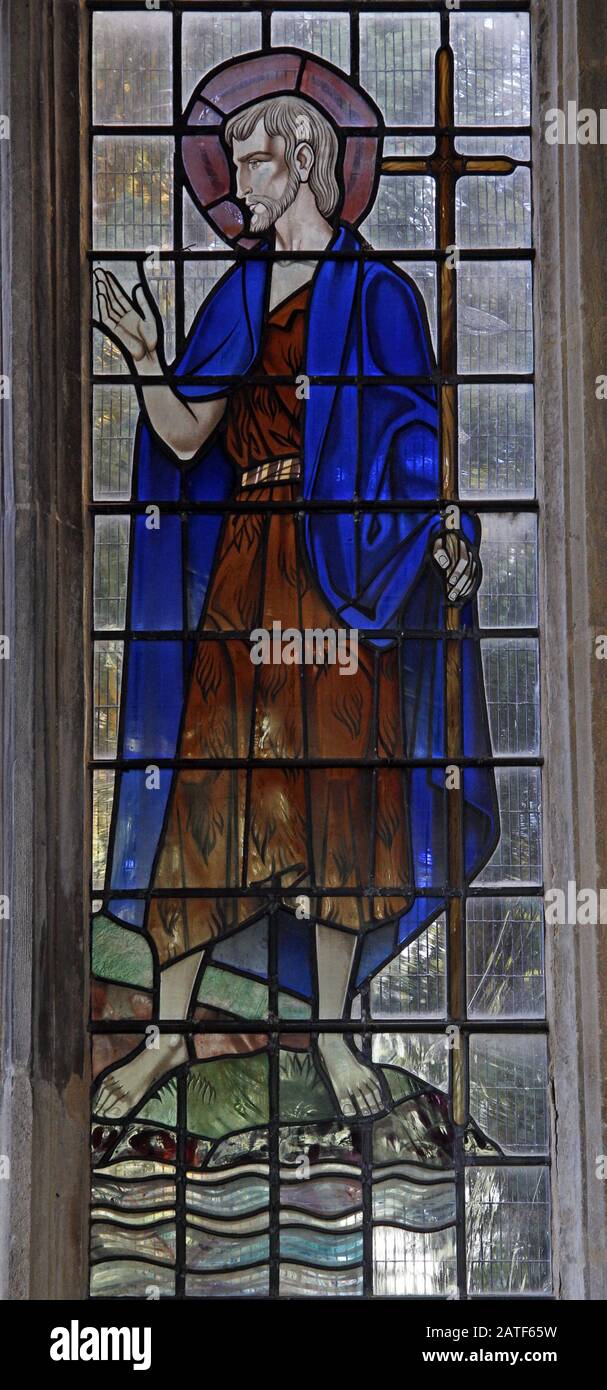 A modern stained glass window by the G. Maile Studios of Canterbury depicting John the Baptist, Ryhall Church, Rutland Stock Photo