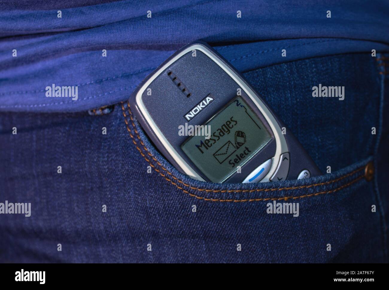 Petrozavodsk. Karelia. Russia. January 8. 2020: Old nokia mobile phone sticks out of a pocket of blue jeans Stock Photo