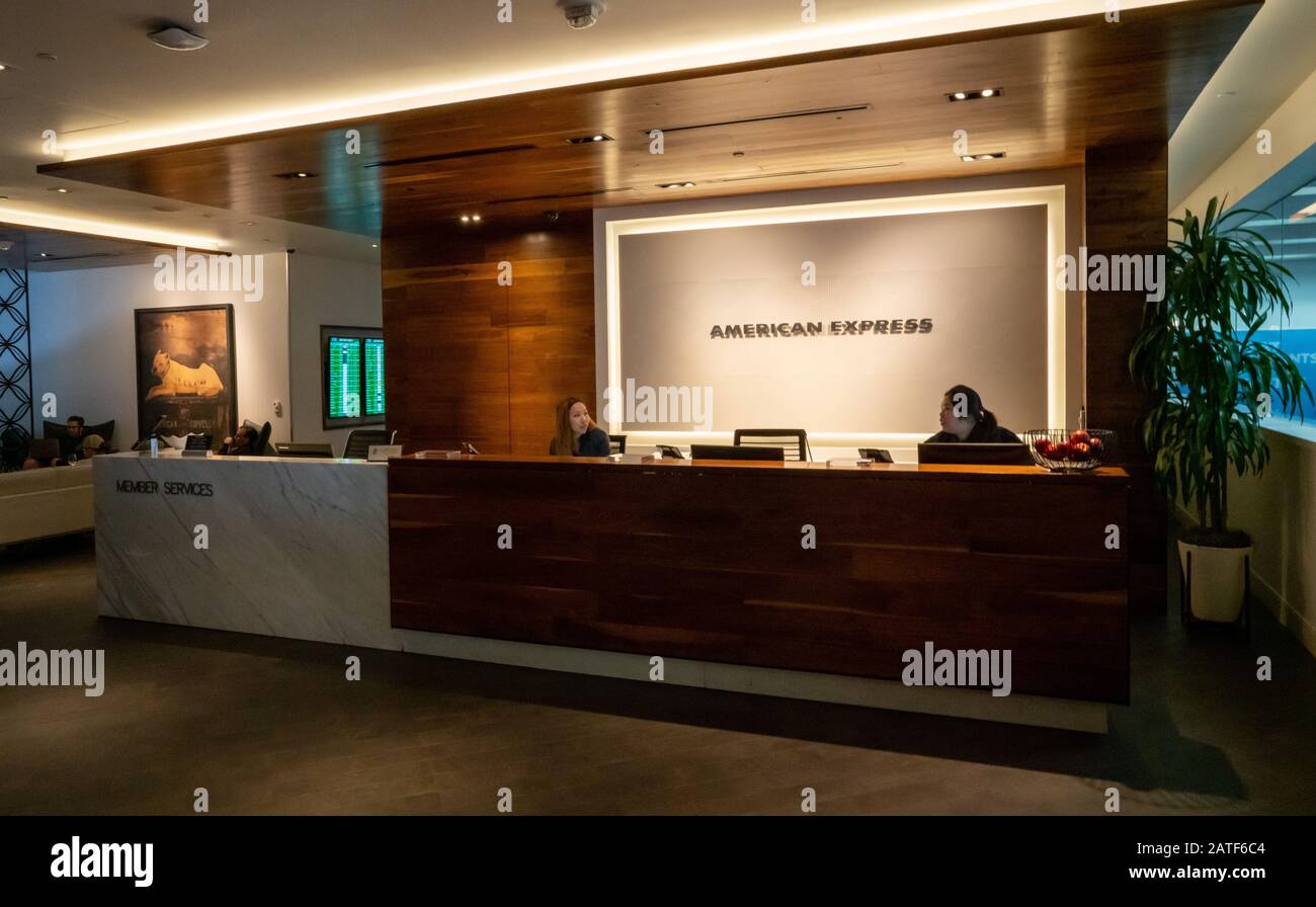 Entrance of an American Express Centurion Lounge with concierge and clerks providing service Stock Photo