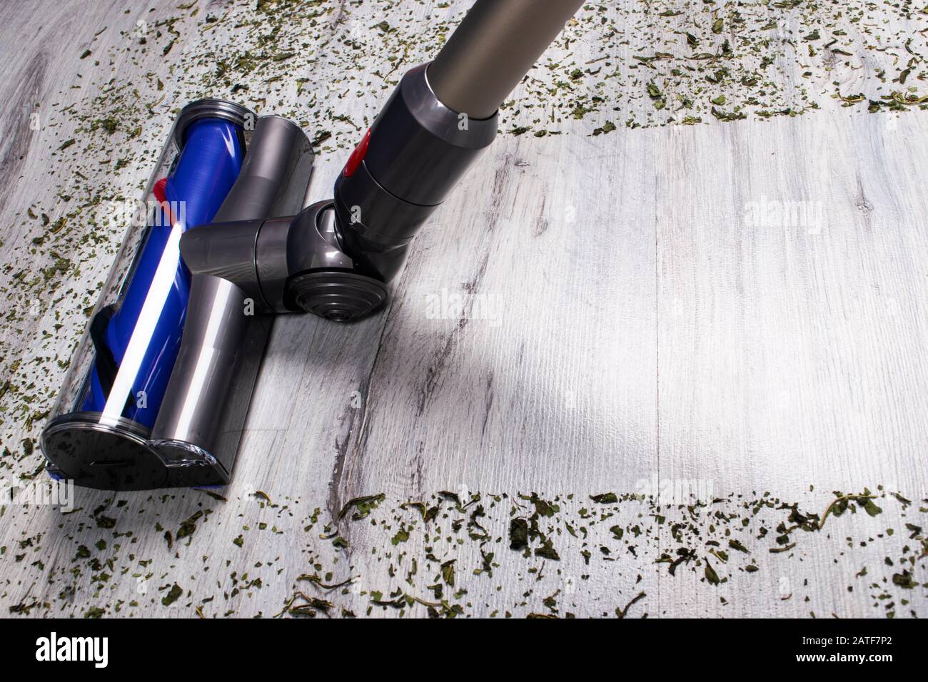 Vacuum cleaner on the floor. House cleaning concept. Before and after cleaning. Dirty and