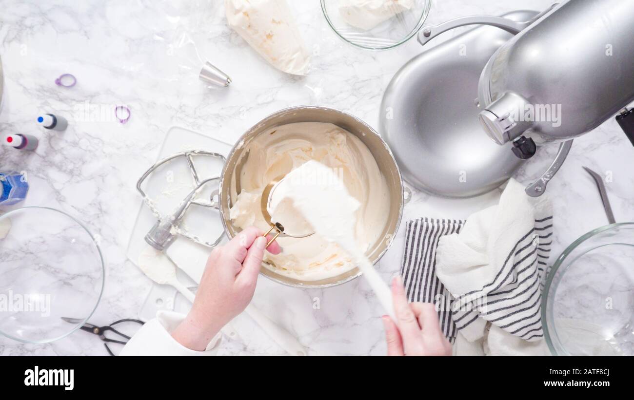 Mixing ingredients in standing kitchen mixer to make buttercream