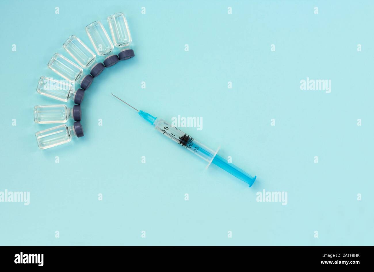 Glass medicine bottles with injection fluid with blue aluminium caps