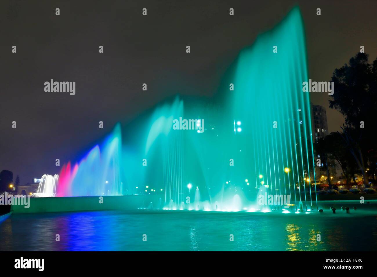 Beautiful view of a colorful water fountain, inside the magical water circuit in Lima, one of the largest existing water theme parks. Lima Peru Stock Photo