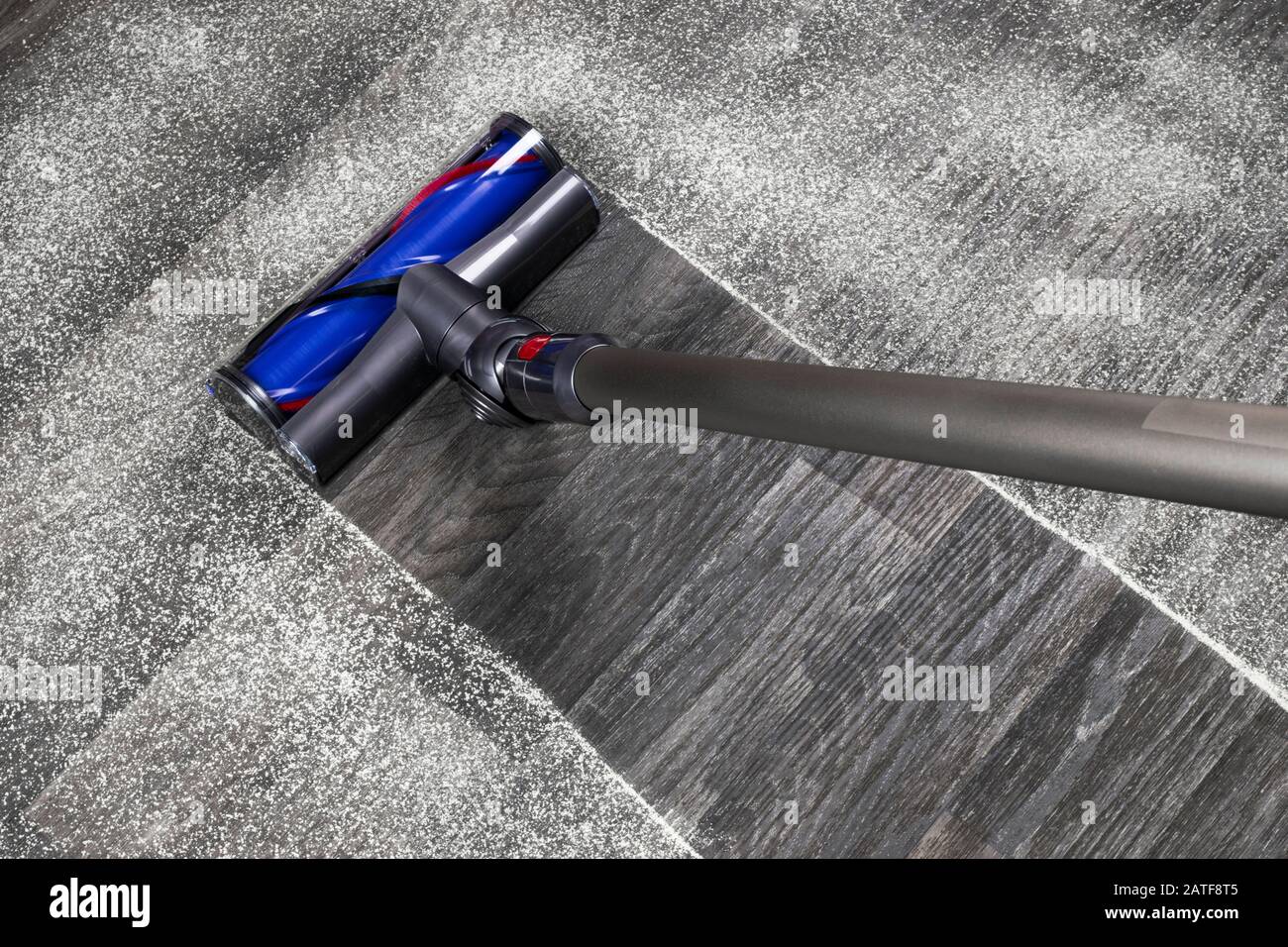 Vacuum cleaner on the floor. House cleaning concept. Before and after