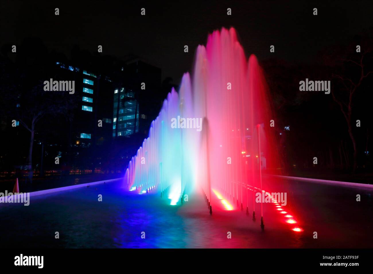 Beautiful view of a colorful water fountain, inside the magical water circuit in Lima, one of the largest existing water theme parks. Lima Peru Stock Photo