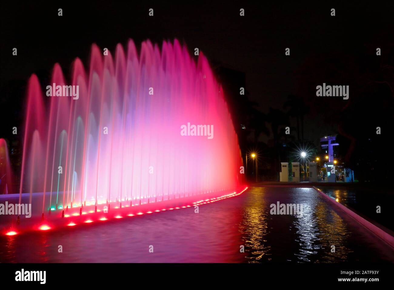 Beautiful view of a colorful water fountain, inside the magical water circuit in Lima, one of the largest existing water theme parks. Lima Peru Stock Photo