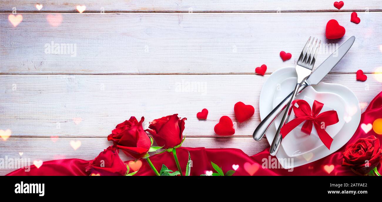 Valentines Day Dinner - Romantic Table Setting With Gift And Roses ...