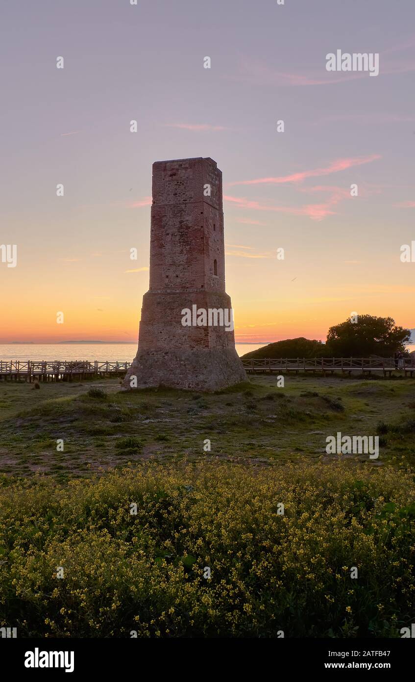 Torre de los ladrones Tower of the Thieves on sunset in Dunas de Artola natural monument, Cabopino, Andalusia, Costa del Sol Stock Photo