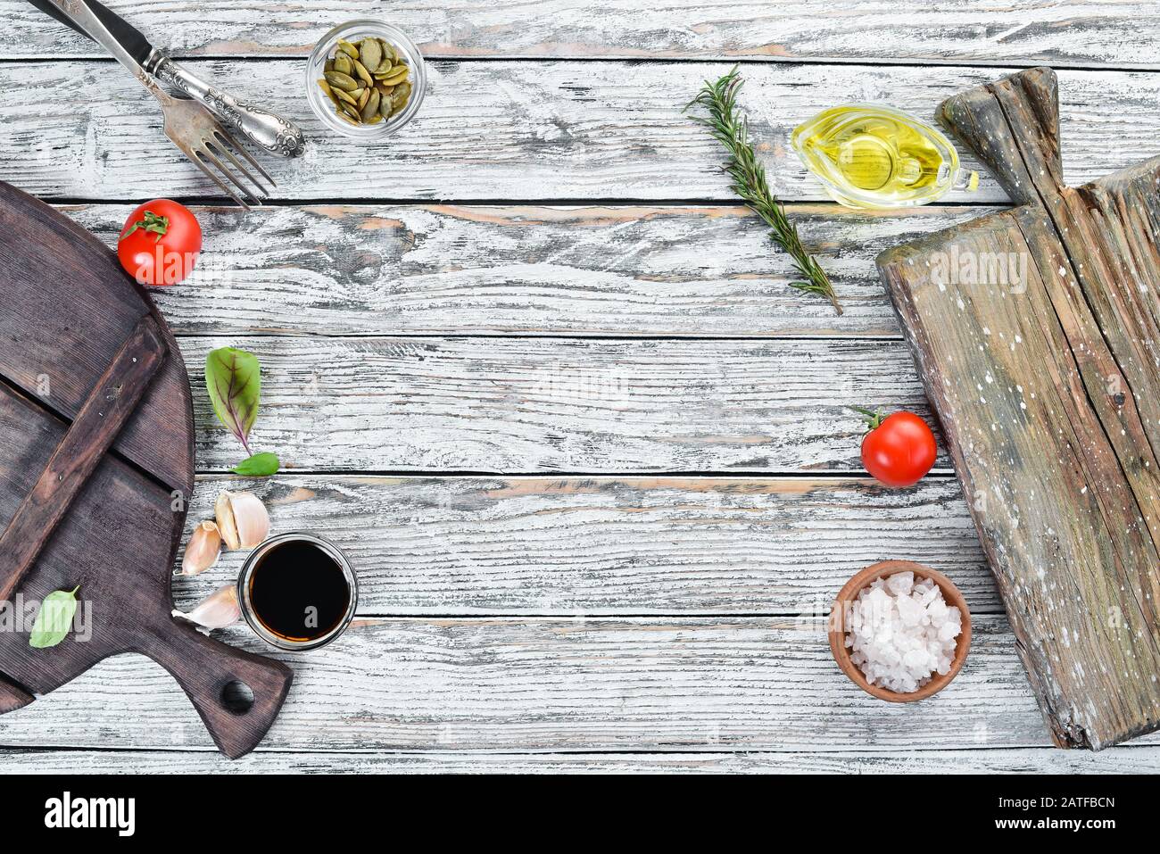 Kitchen wooden board. Food Background. On a wooden background. Top view.  Free space for your text Stock Photo - Alamy