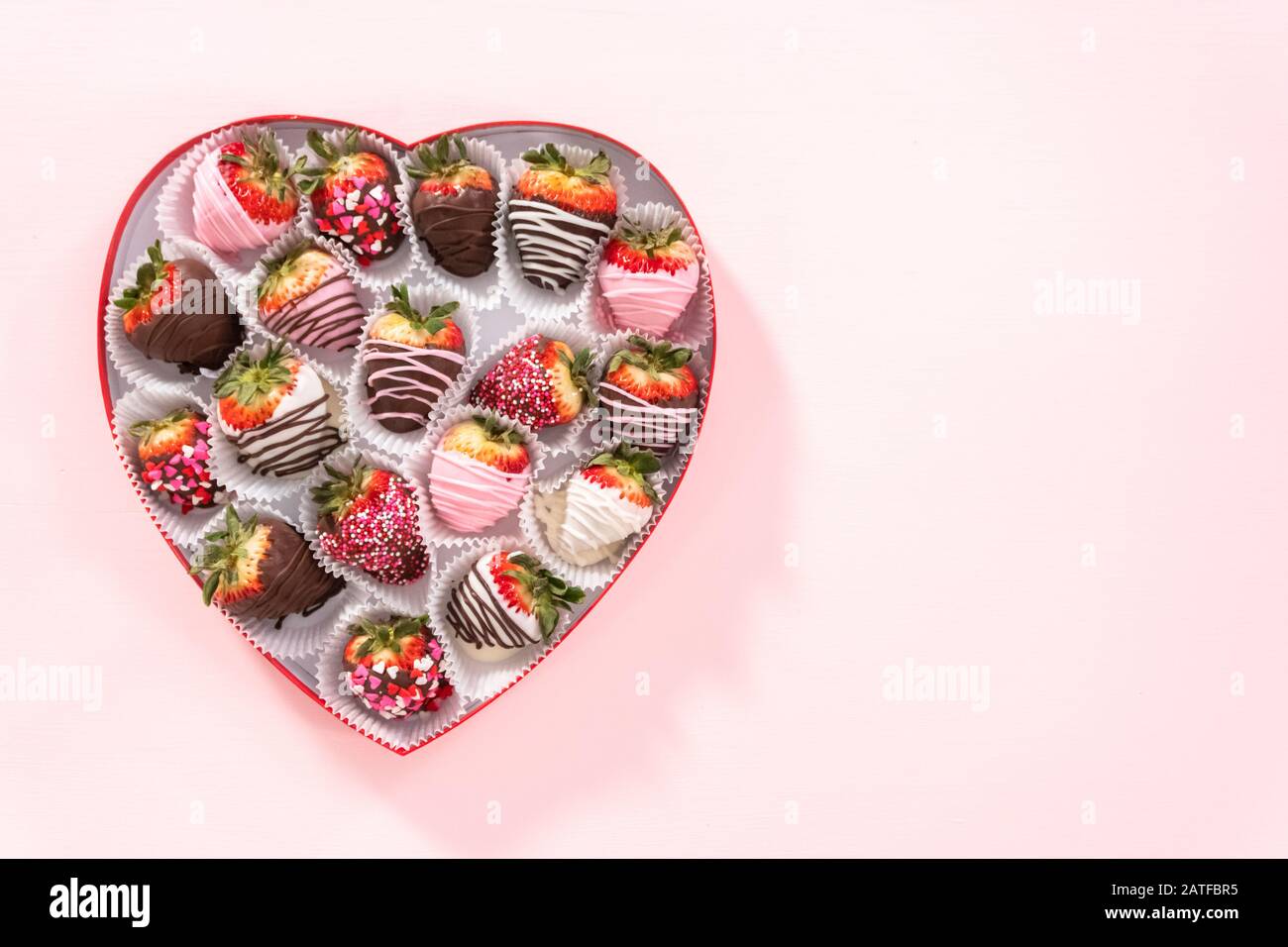 Flat Lay Variety Of Chocolate Dipped Strawberries In A Heart