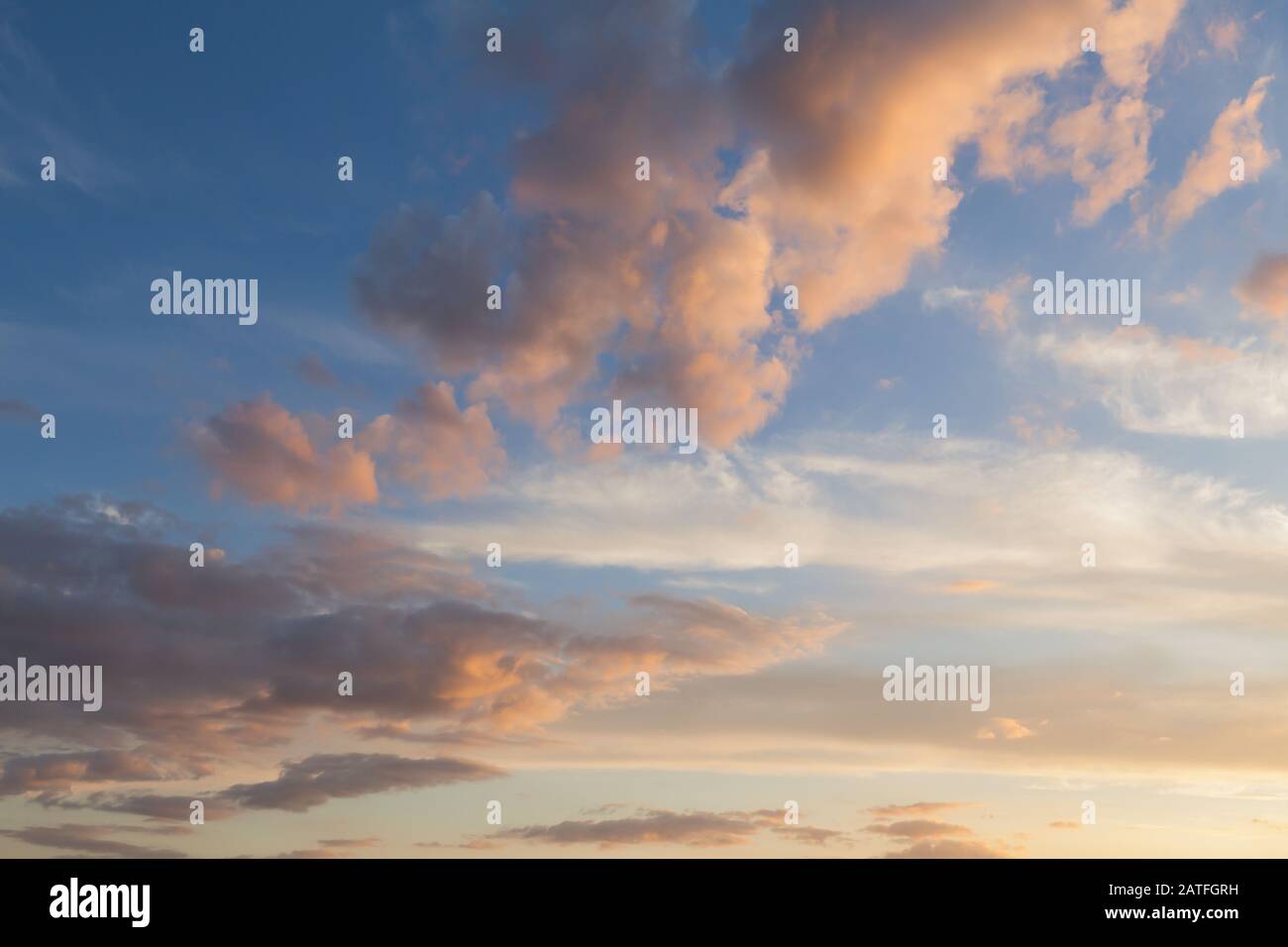 Beautiful clouds and blue sky background at sunset with pink and purple ...