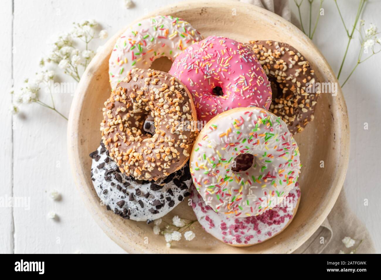 Homemade donuts with various decoration on white plate Stock Photo - Alamy
