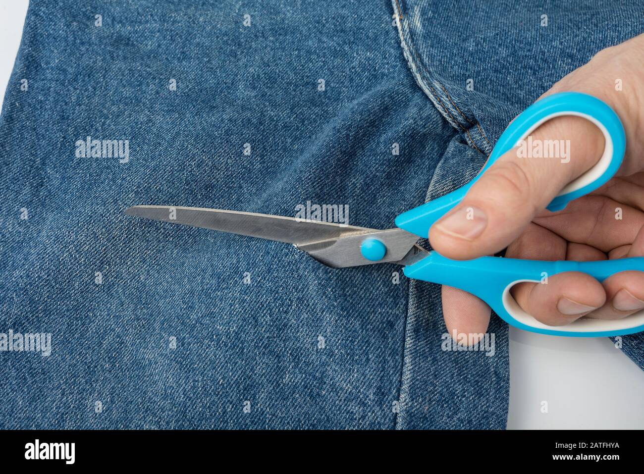 blue jeans with scissors Stock Photo 