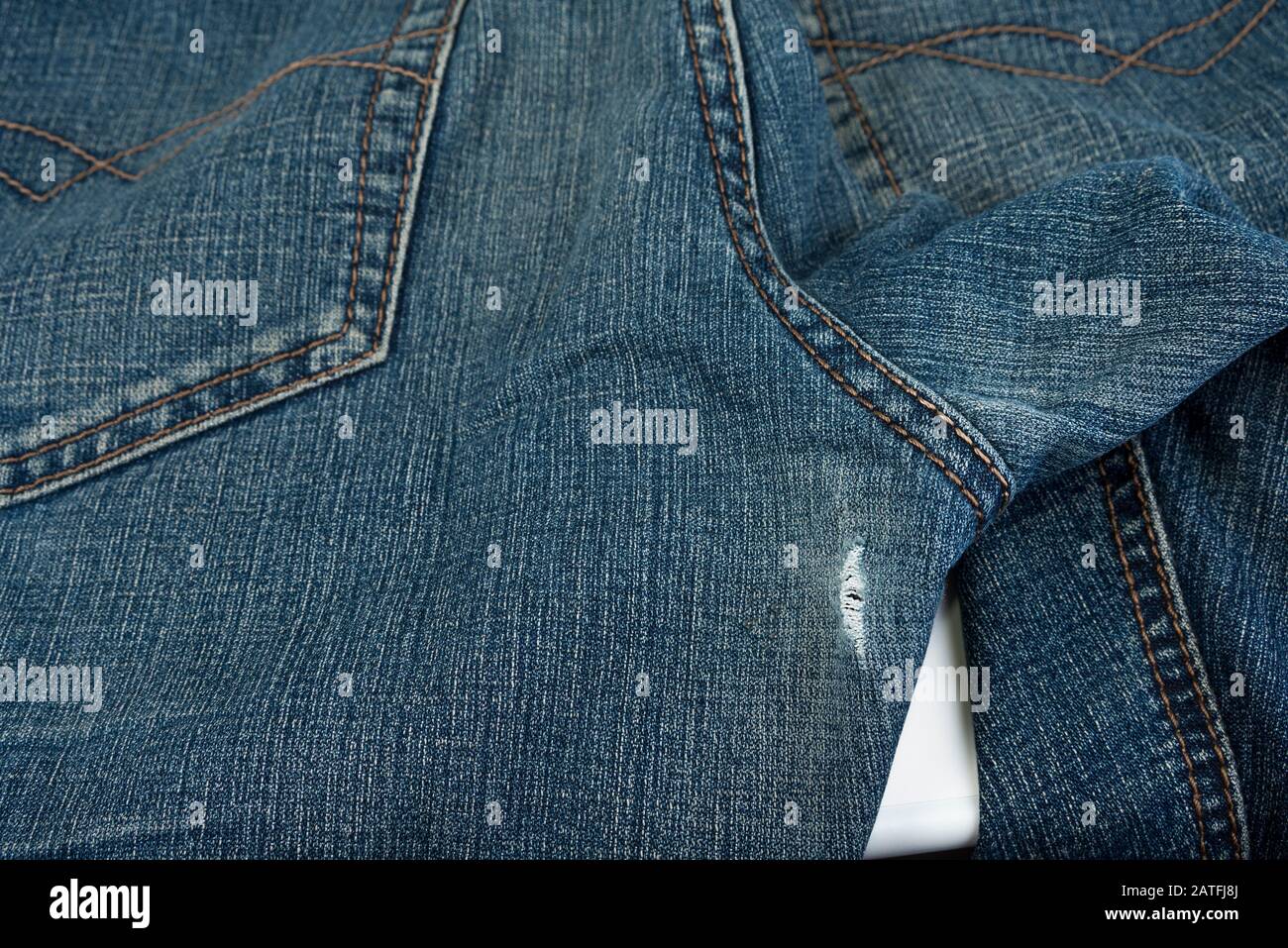 The worn out between the thigh area in your jeans Stock Photo - Alamy