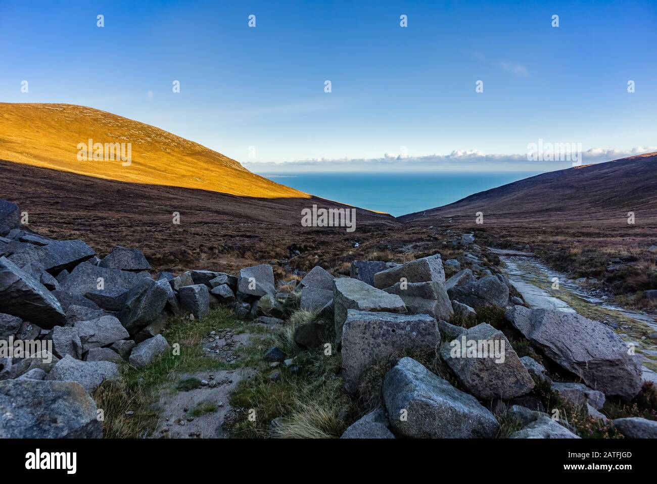 Mourne Mountains are the highest and most dramatic mountain range in Northern  Ireland. View from valley near Slieve Donard mountain peak on Irish Sea  Stock Photo - Alamy