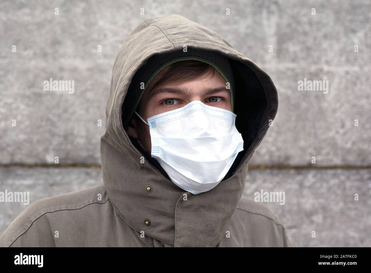 a man in a medical mask, protection against influenza, coronavirus and other viral colds. Stock Photo