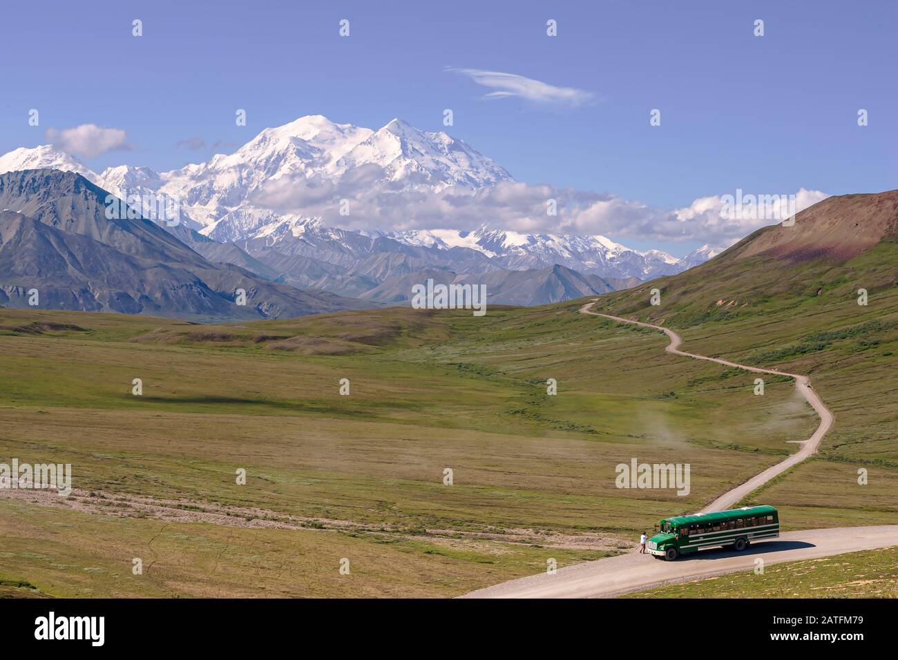 Tourist Shuttle Bus, tourists looking at Denali from Stoney Overlook Denali National Park, Alaska Stock Photo