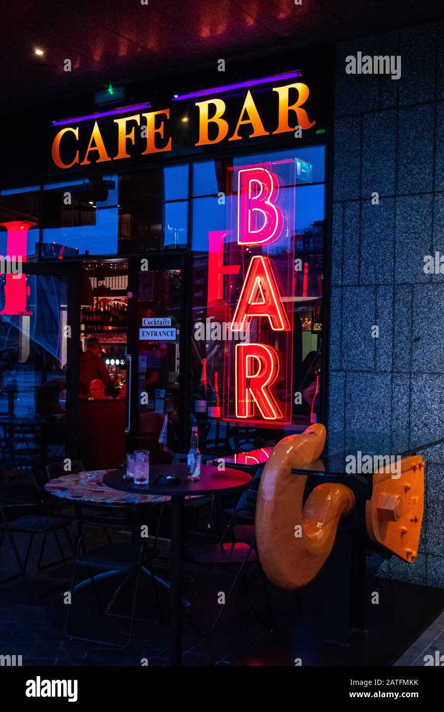 Neon light sign with bar and caffe. Bar and caffe neon sign. Dublin Ireland September 2019 Stock Photo