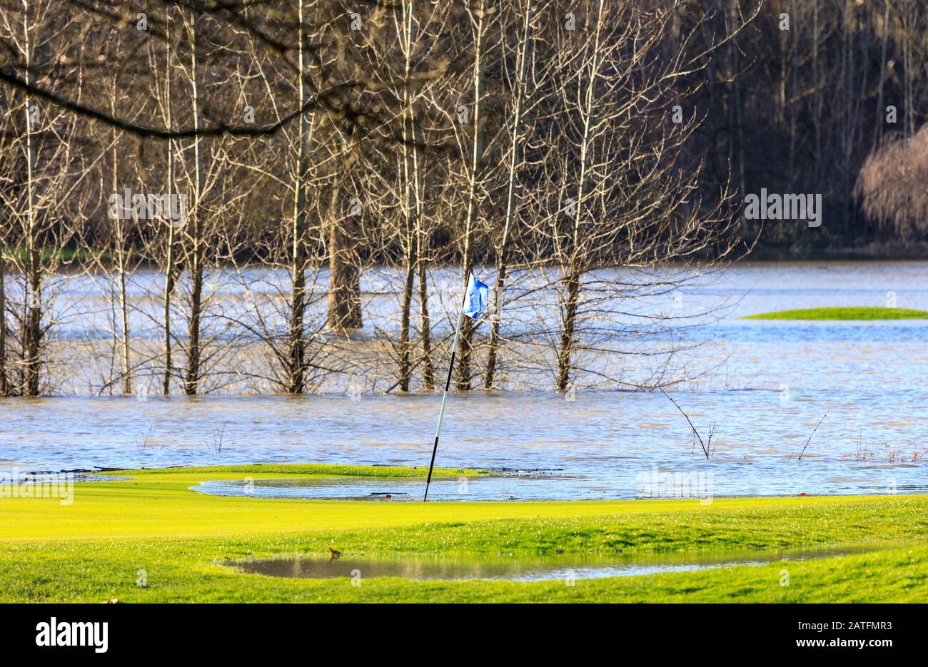 Golf course green flooded after extreme rainfall Stock Photo Alamy