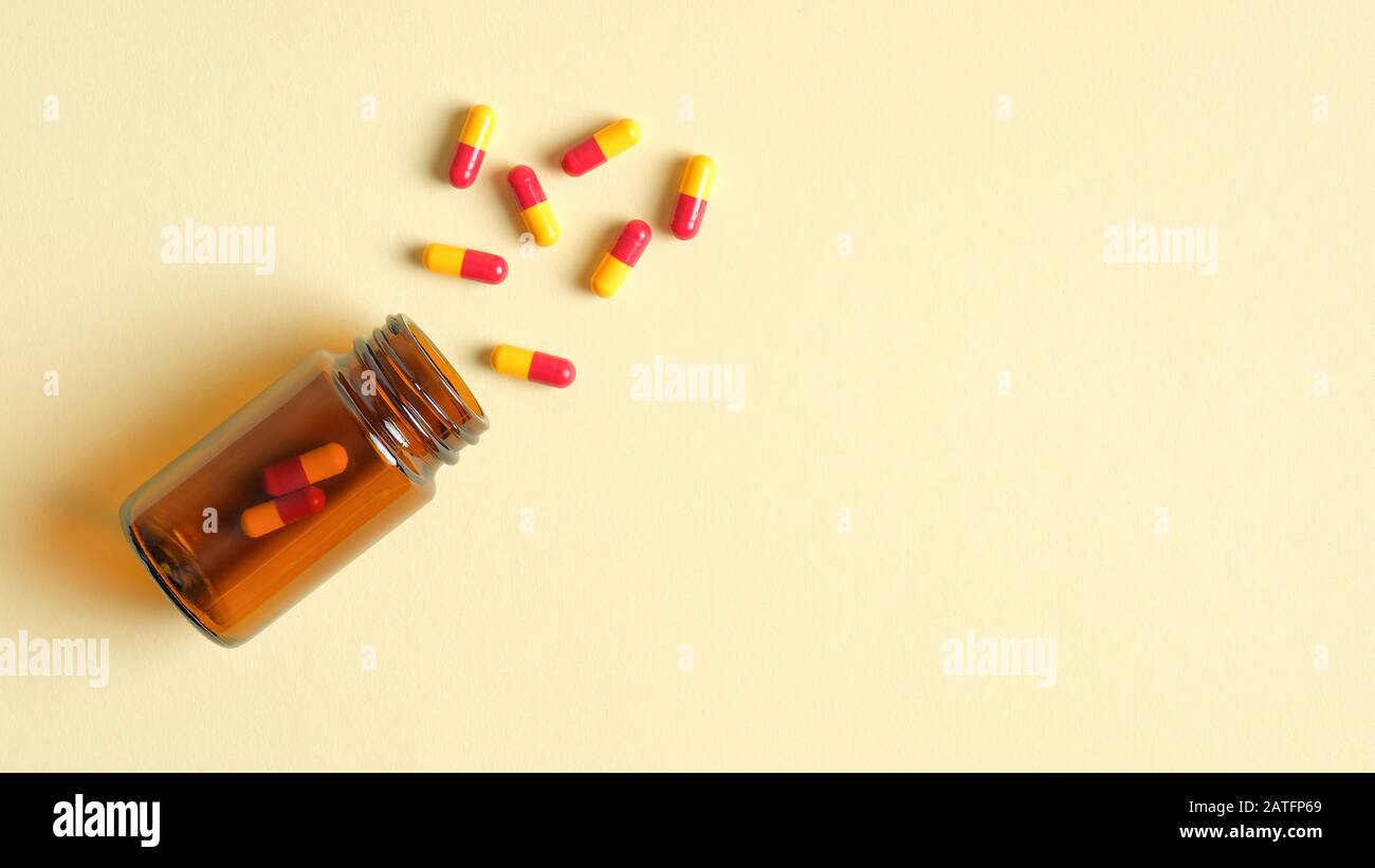 Capsules Pills Spilling From A Bottle Top View Pharmacy Store