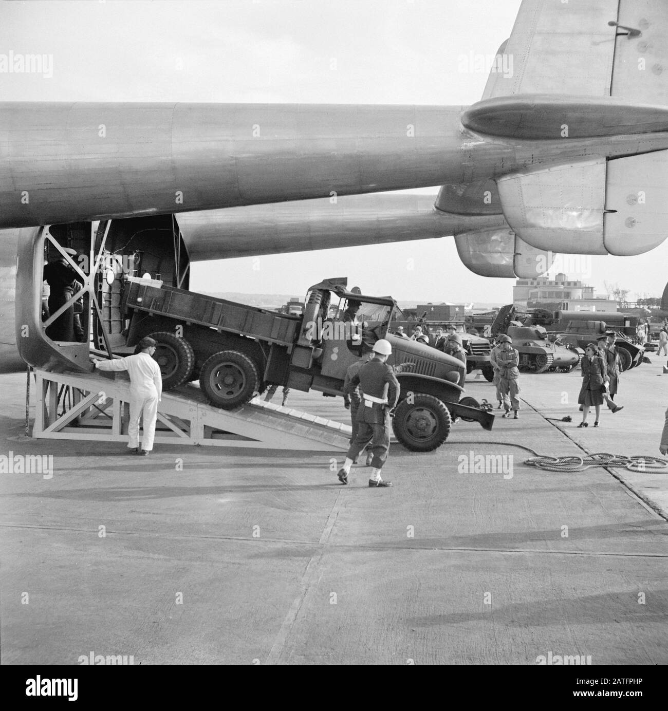 Heavy Army Truck being driven off Army Air Forces' new C-82 in Demonstration of Equipment held by United States Army Air Forces, National Airport, Washington, D.C., USA, photograph by Pauline Ehrlich, U.S. Office of War Information, October 1944 Stock Photo