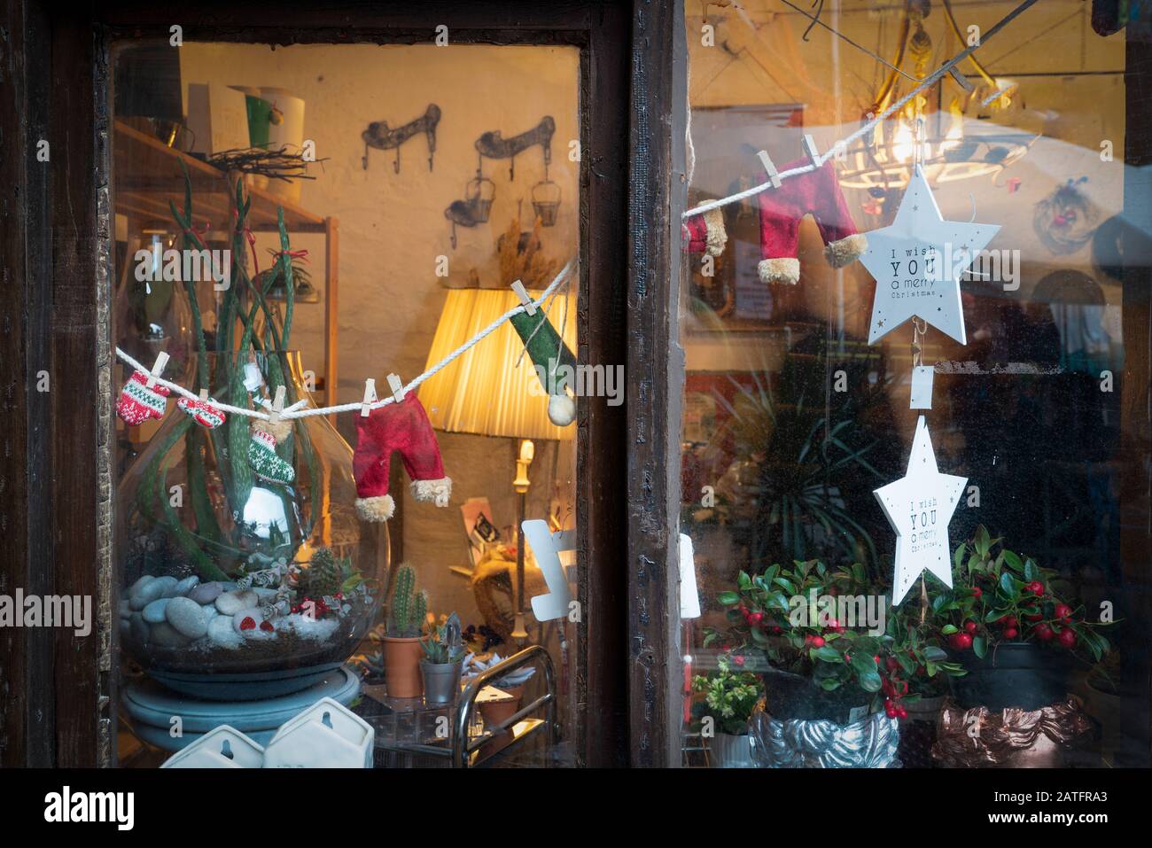 Atmospheric Christmas window sill decoration: snow, tree, candle, rocking Stock Photo