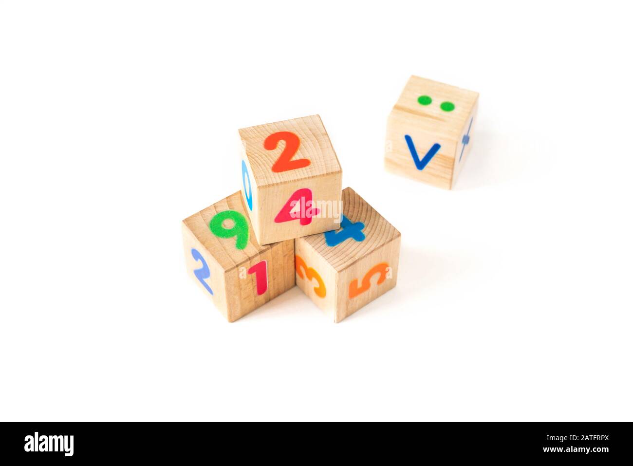 Kids toys wooden cubs with numbers on white background. Developing wooden blocks. Natural, eco-friendly toys for children. Top view. Flat lay. Copy space. Stock Photo