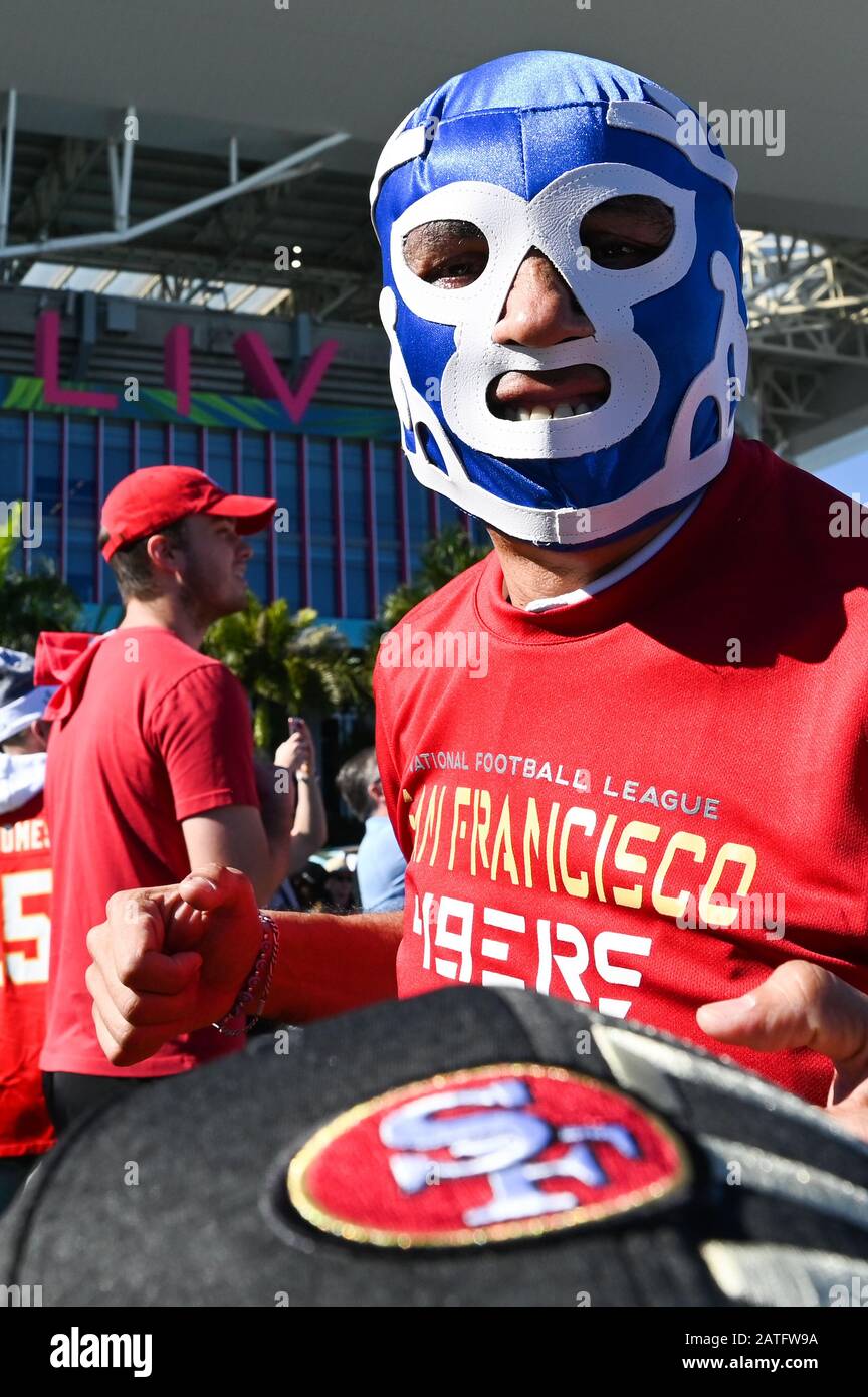 Miami, Florida, USA. 02nd Feb, 2020. A 49ers fan with a luchador mask on holds a hat before Super Bowl LIV between the San Francisco 49ers and the Kansas City Chiefs held at Hard Rock Stadium in Miami Gardens, Florida on Feb. 2, 2020. (Photo by Anthony Behar/Sipa USA) Credit: Sipa USA/Alamy Live News Stock Photo