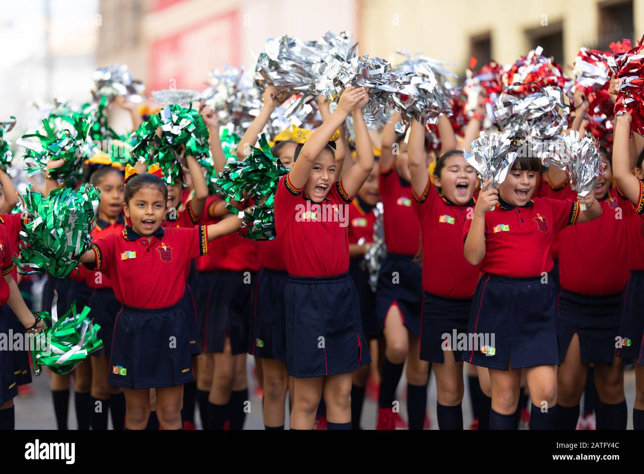 Matamoros, Tamaulipas, Mexico - November 20, 2019: The Mexican Revolution Day Parade, School girls using Pom-poms, cheering during the parade Stock Photo