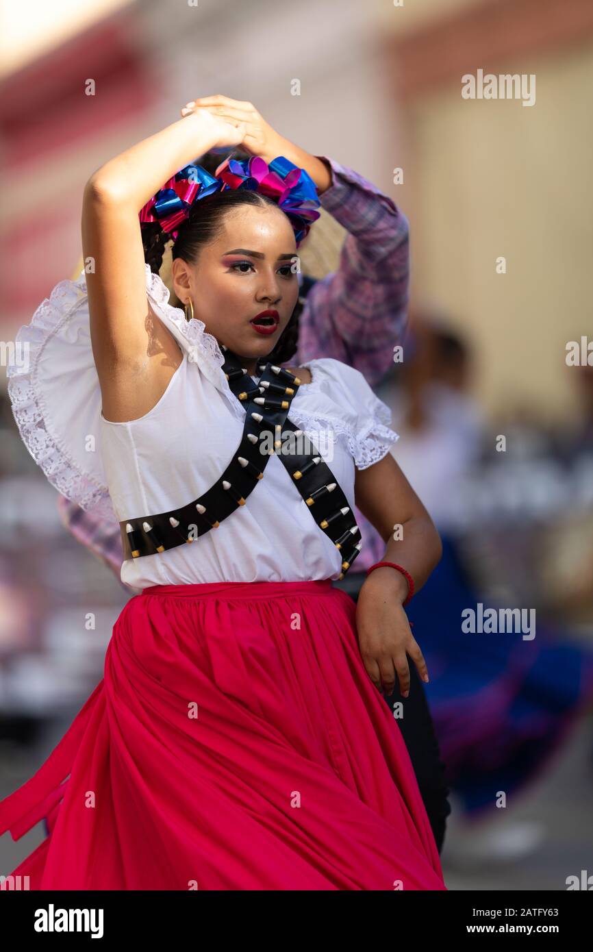 Matamoros, Tamaulipas, Mexico - November 20, 2019: The Mexican Revolution Day Parade, Mexican traditional dancers wearing traditional clothing perform Stock Photo