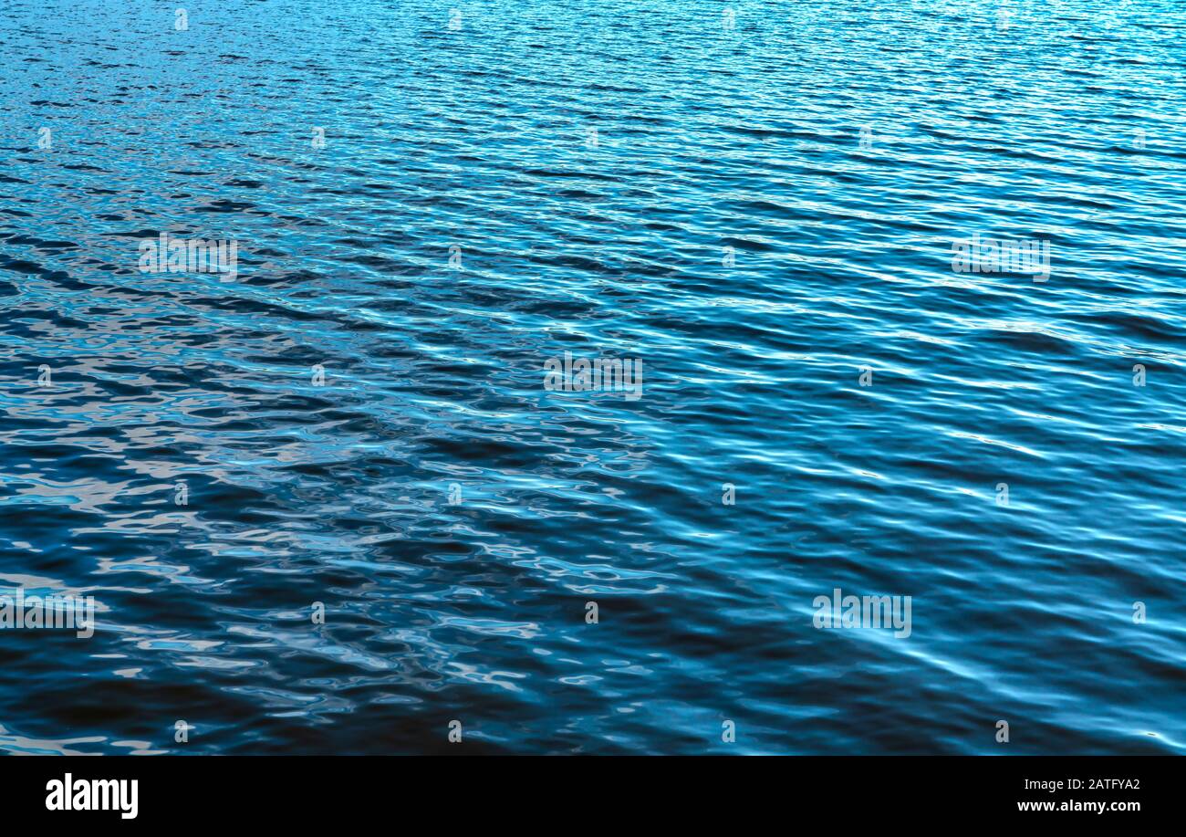 Blue water surface background, texture or pattern Stock Photo