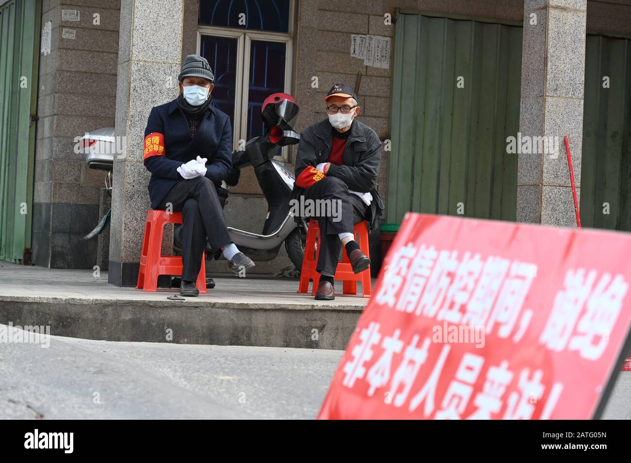 A person wearing a face mask is on duty in Quanzhou, Fujian, China. on 2th Feb 2020. According to recent data, the number of people infected with the new strain of coronavirus has risen over 14,000, with the death toll reaching 305. Credit: CPRESS PHOTO LIMITED/Alamy Live News Stock Photo