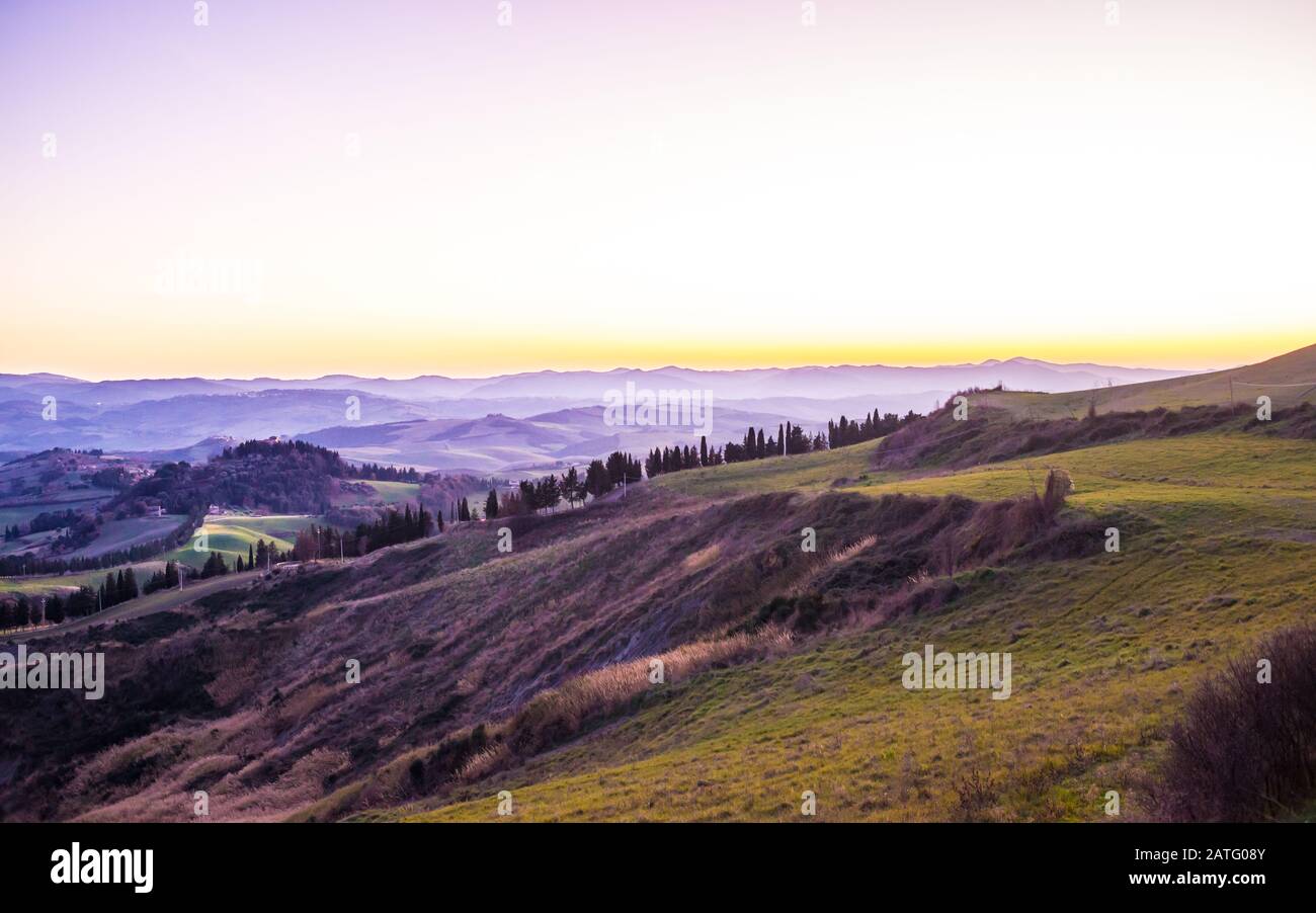 Tuscany hills countryside Italian landscape colorful at sunset. Italy. Stock Photo