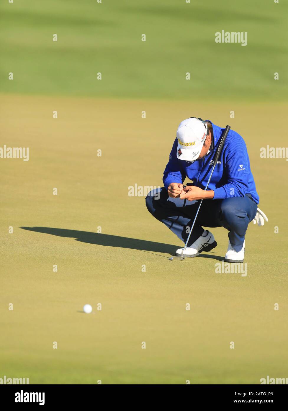 TPC Scottsdale, Arizona, USA. 2nd Feb, 2020. Hideki Matsuyama studies the line for his putt on the second hole during the final round of the Waste Management Phoenix Open Credit: Action Plus Sports/Alamy Live News Stock Photo