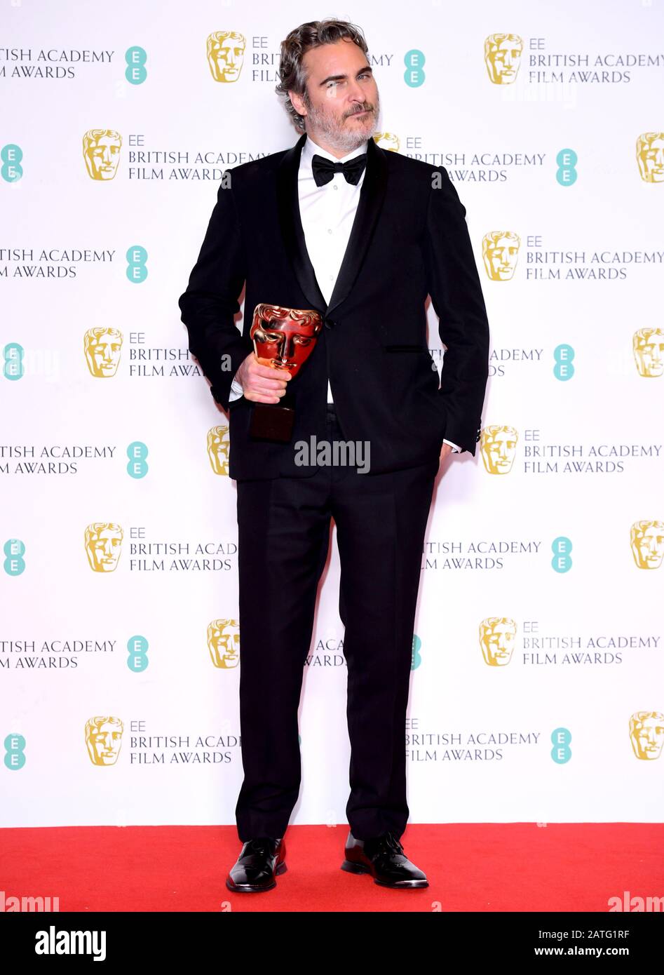 Joaquin Phoenix with his award for Best Actor in the press room at the 73rd British Academy Film Awards held at the Royal Albert Hall, London. Stock Photo