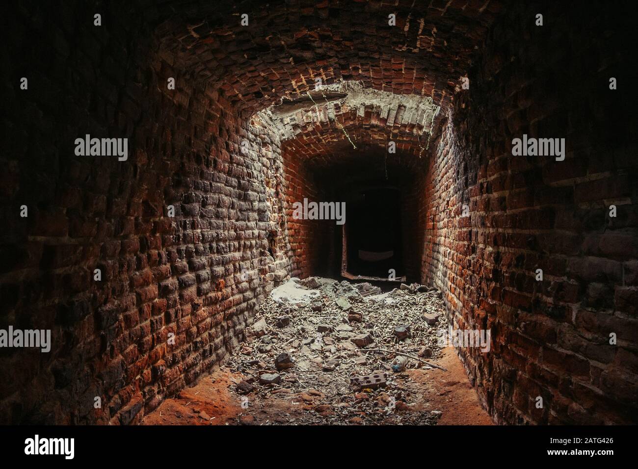 Historical underground red brick passage under old city Stock Photo