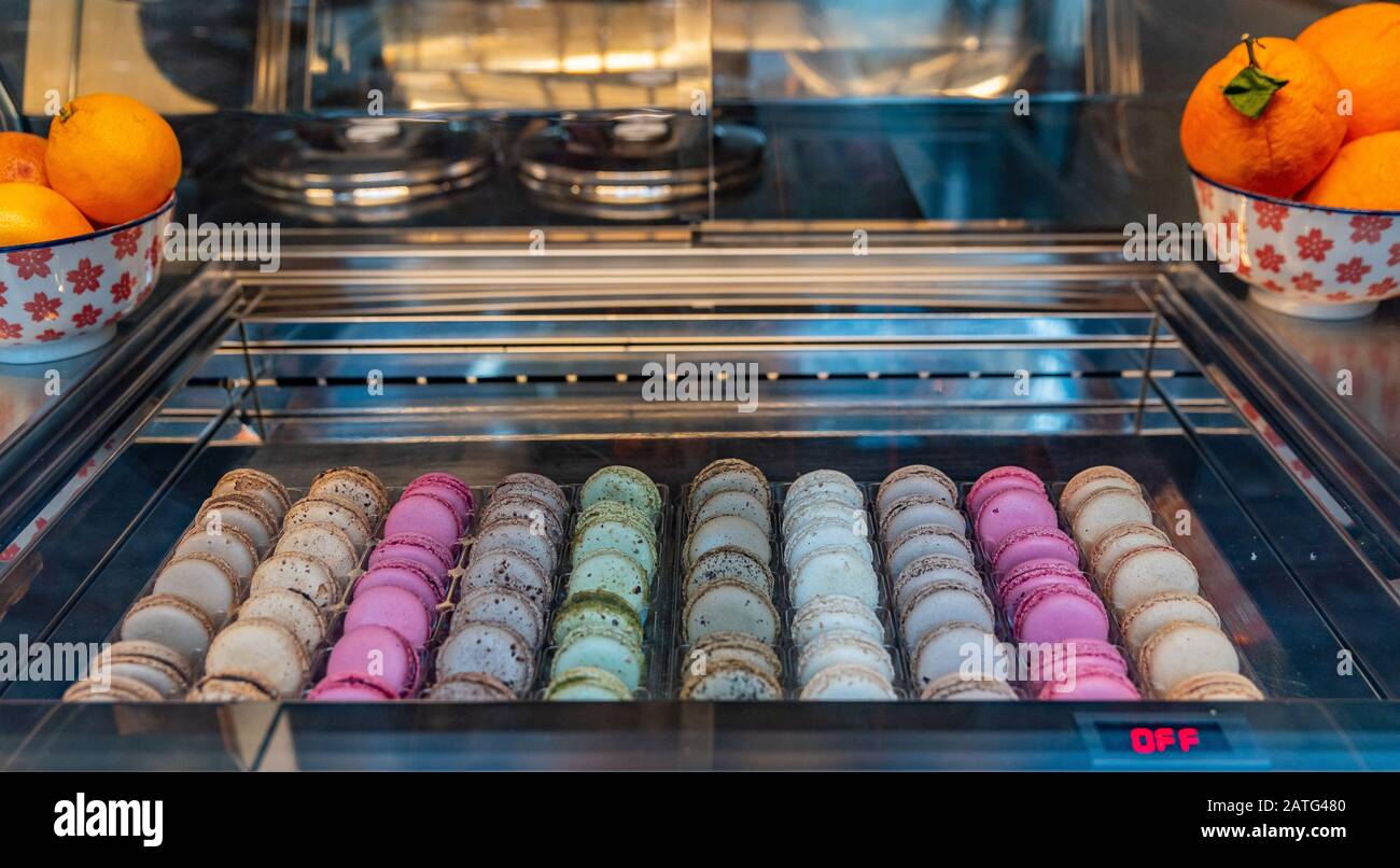 Macarons displayed in a shop window of a pastry shop in Bergamo in Italy Stock Photo
