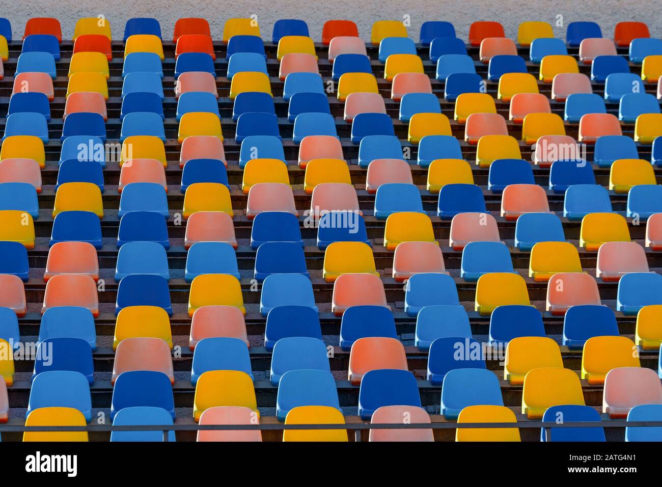 Blue and orange stadium plastic seats. Colorful texture Stock Photo - Alamy
