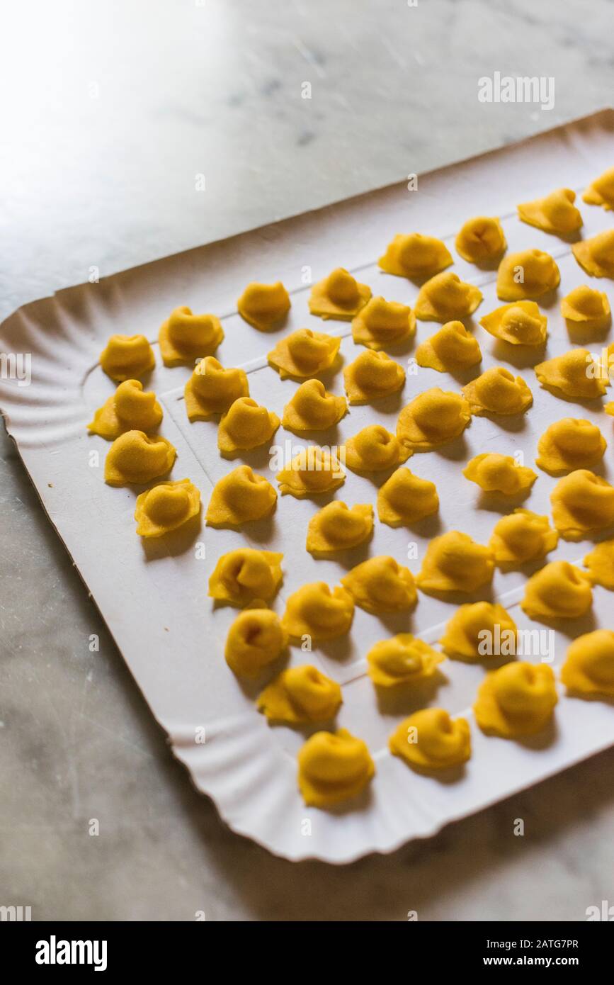 Tray of Italian handmade tortellini. Stock Photo
