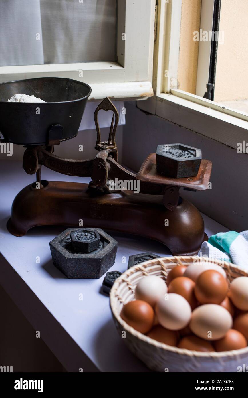 Flour being weighted on vintage scale Stock Photo