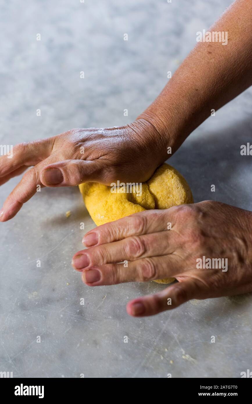 Italian woman kneading homemade pasta dough Stock Photo Alamy