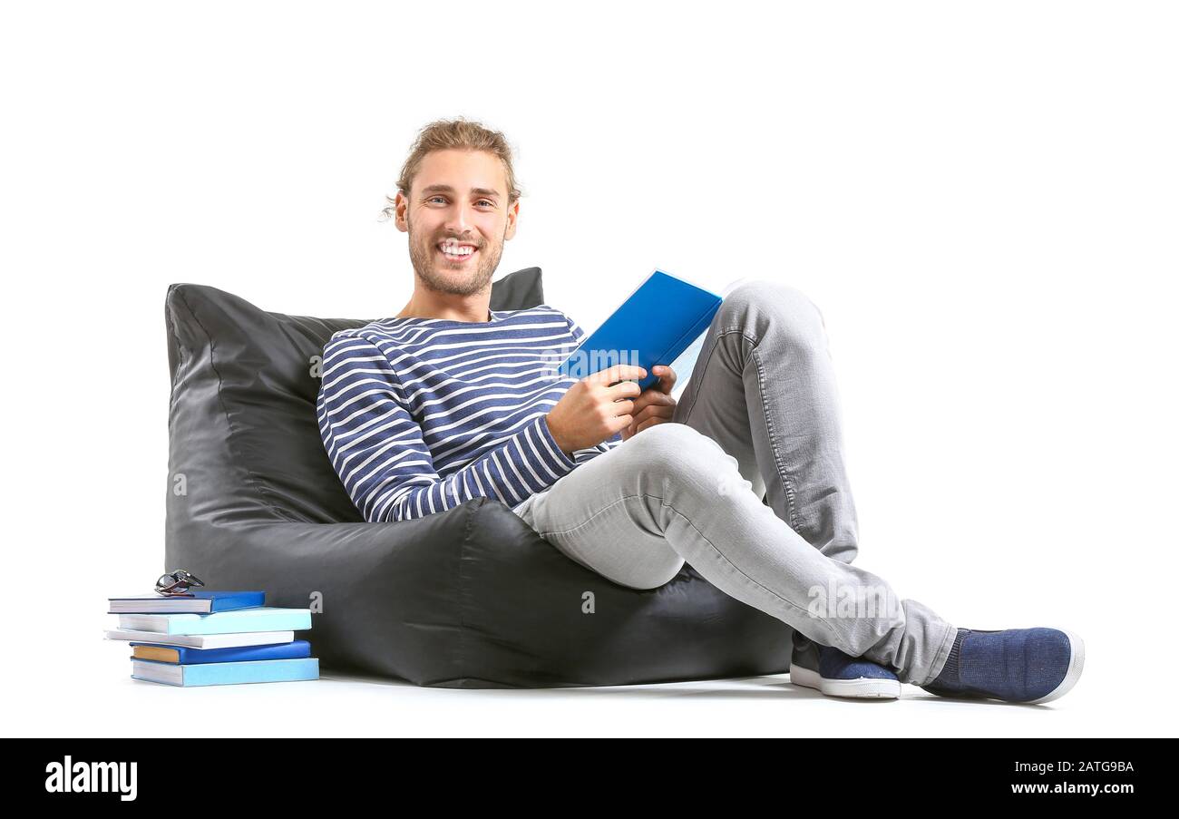 Handsome man reading book on white background Stock Photo