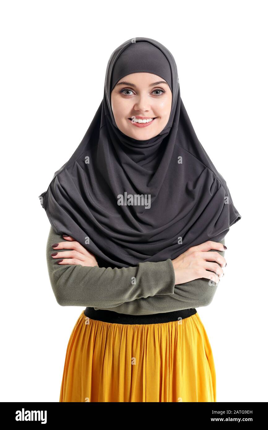 Beautiful young Muslim woman on white background Stock Photo - Alamy