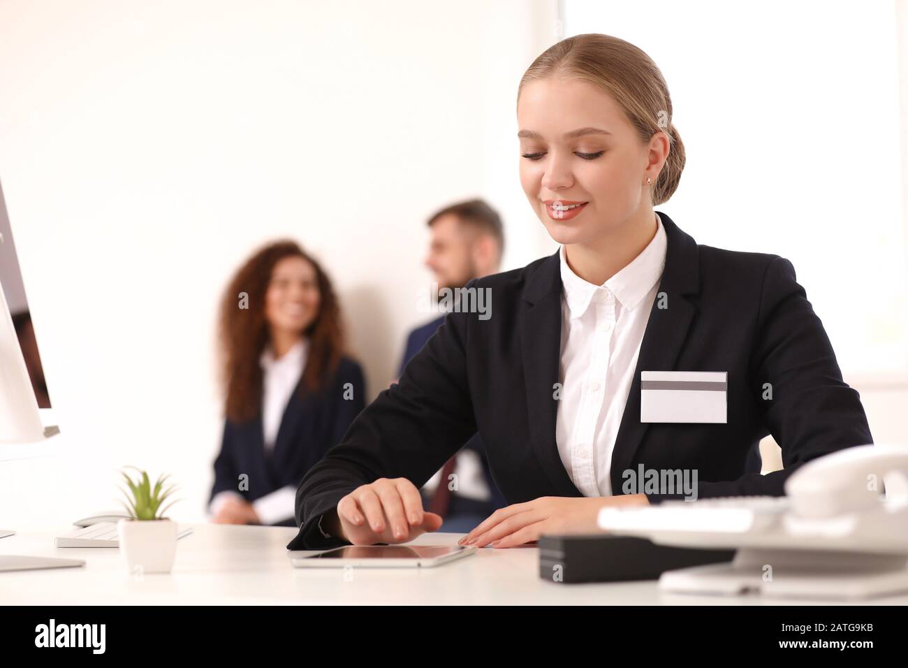 Female secretary working in office Stock Photo - Alamy