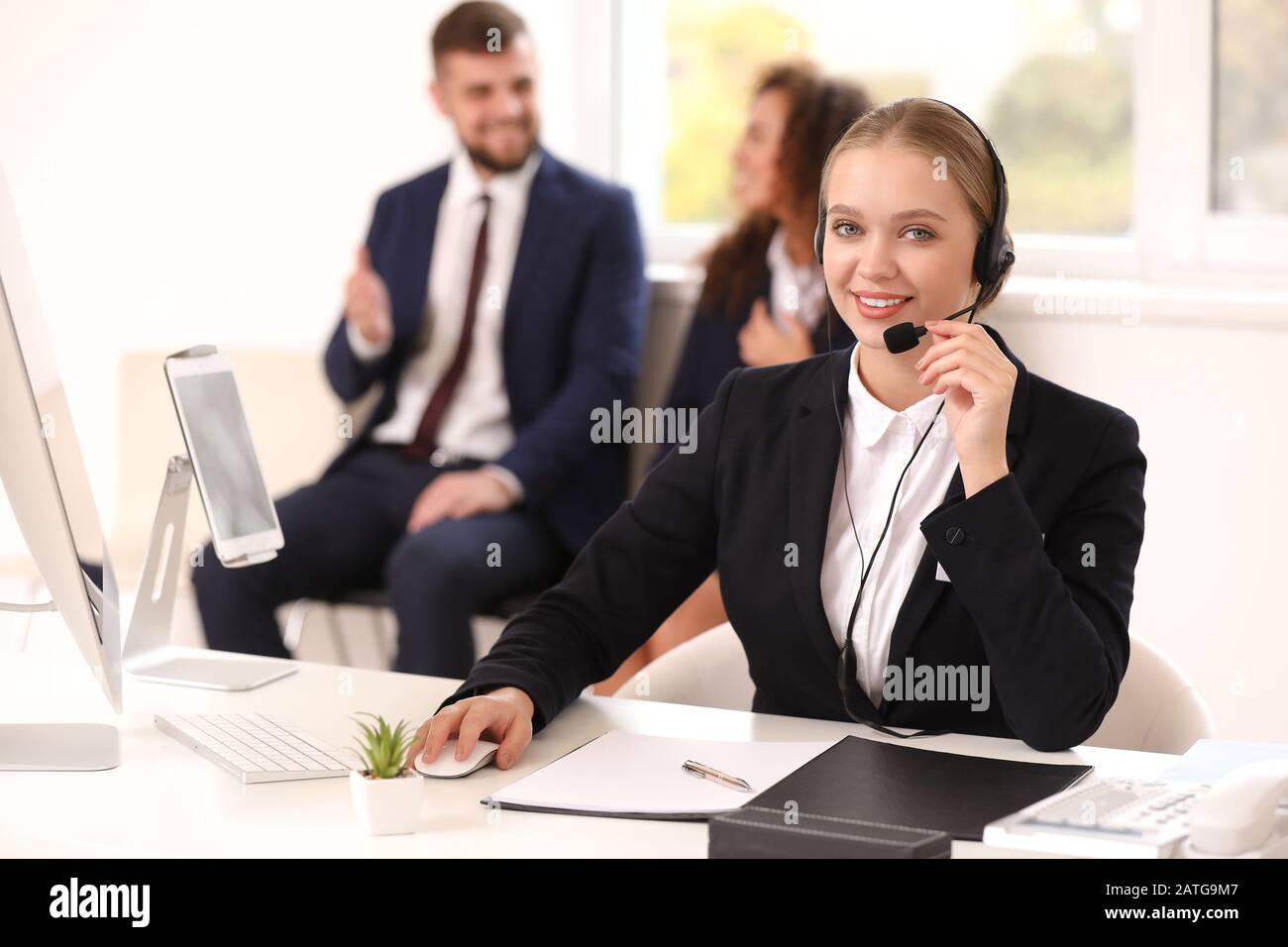 Female secretary working in office Stock Photo - Alamy