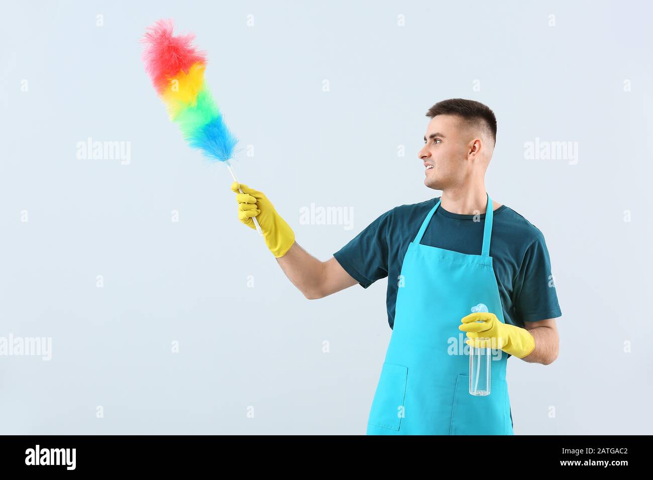 Portrait of janitor on light background Stock Photo - Alamy