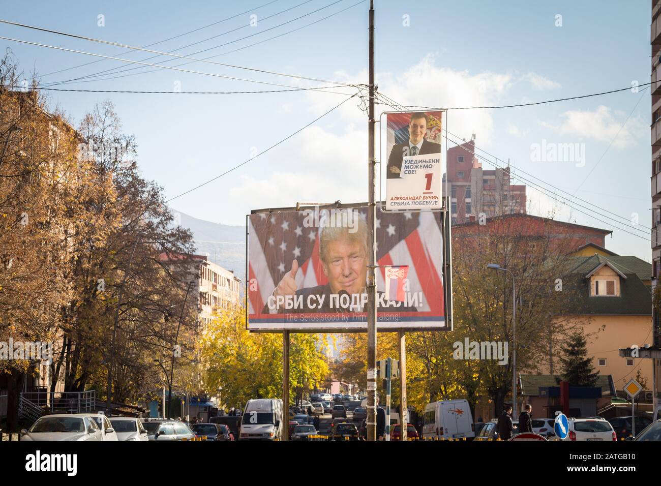 MITROVICA, KOSOVO - NOVEMBER 11, 2016: Serbian poster supporting Donald Trump near a potrait of the Serbian former Prime Minister and now president, A Stock Photo