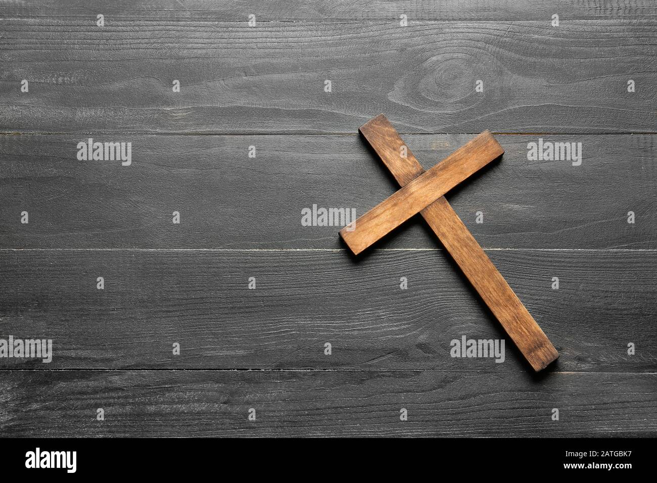 Christian cross on wooden background Stock Photo - Alamy